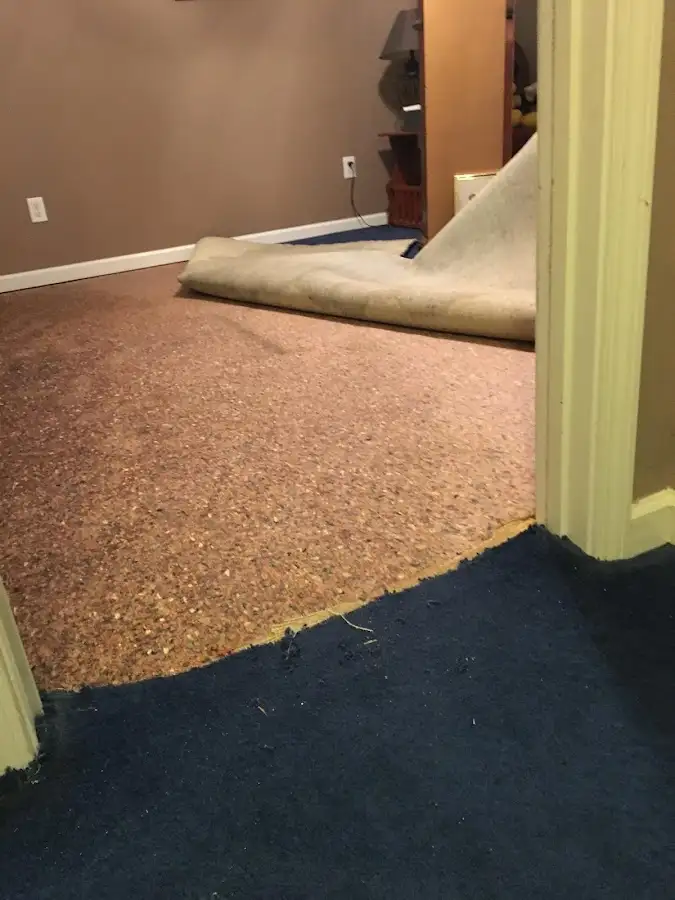 Carpet pad removal revealing water damage during Drying & Dehumidification in Brownfield